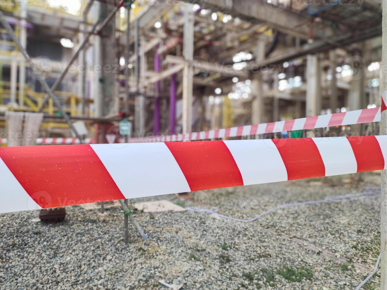 Tap red white color warning barrier safety hazard caution stop line sign in industrial factory area photo