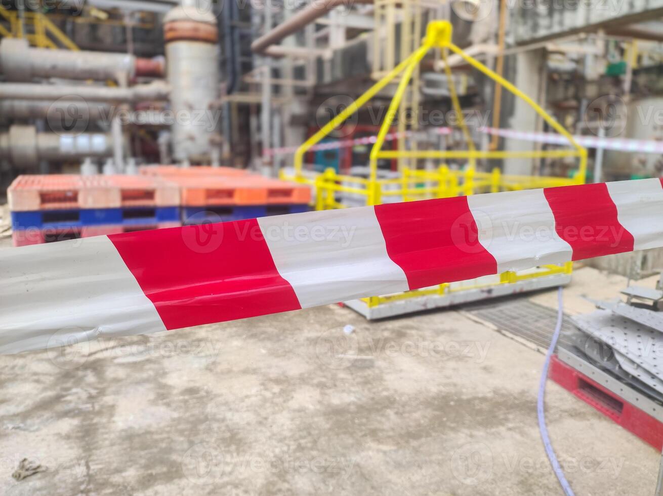 Tap red white color warning barrier safety hazard caution stop line sign in industrial factory area photo