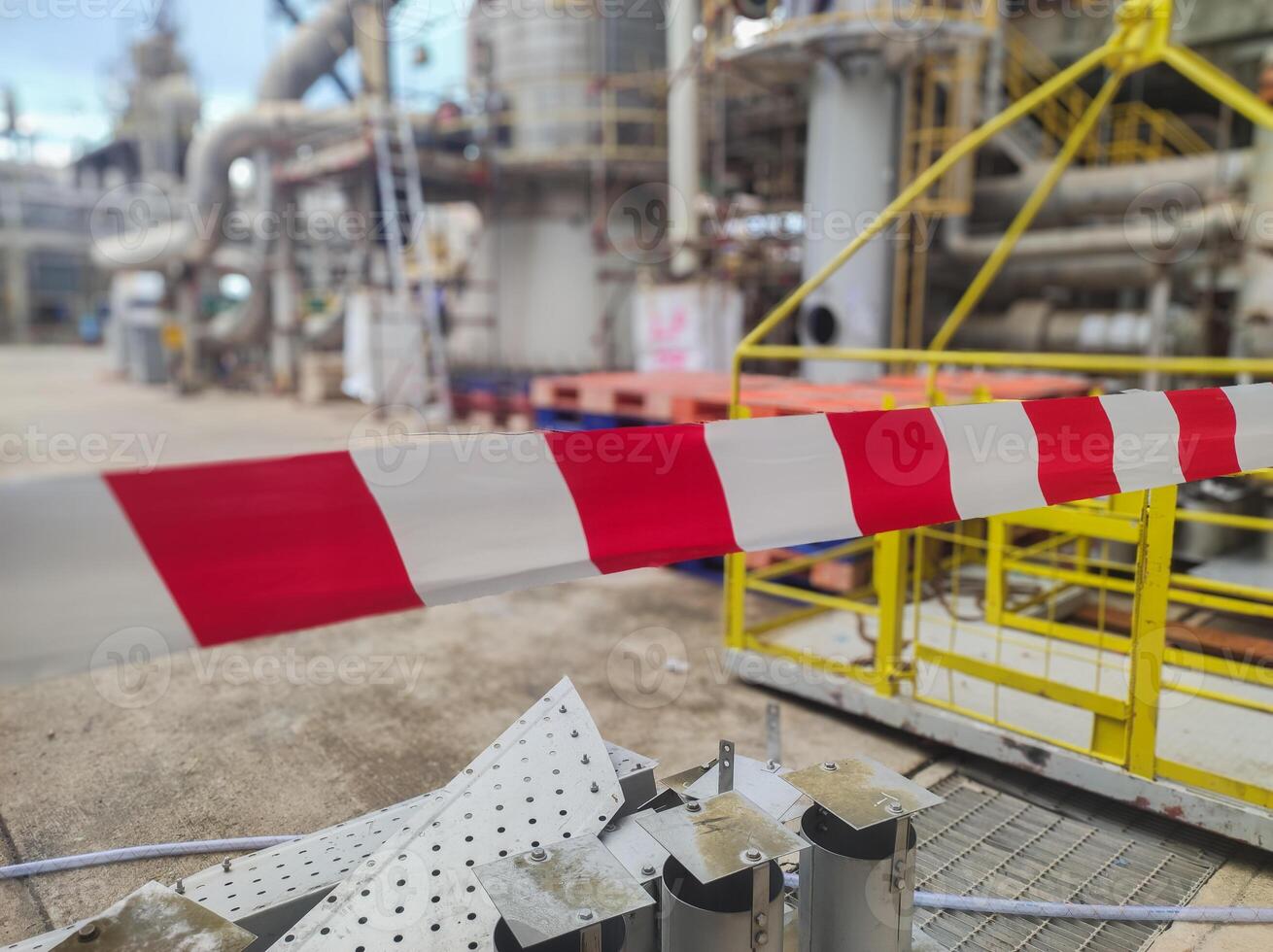 Tap red white color warning barrier safety hazard caution stop line sign in industrial factory area photo