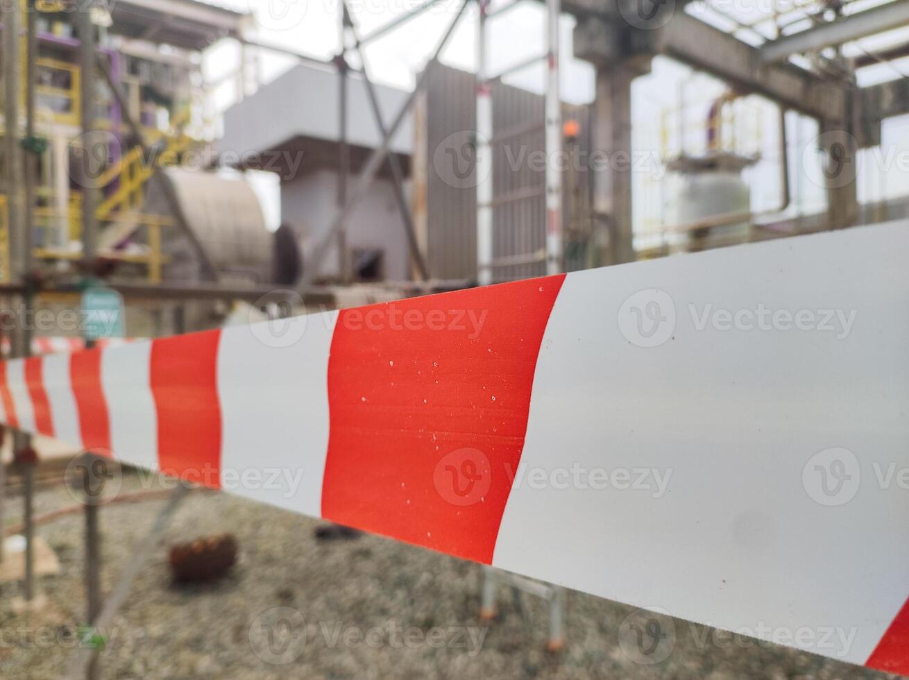 Tap red white color warning barrier safety hazard caution stop line sign in industrial factory area photo
