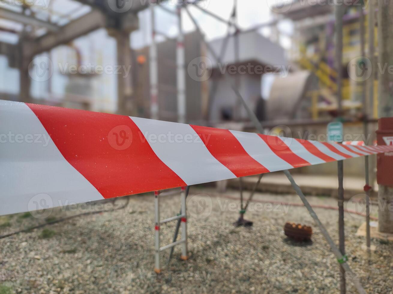 Tap red white color warning barrier safety hazard caution stop line sign in industrial factory area photo