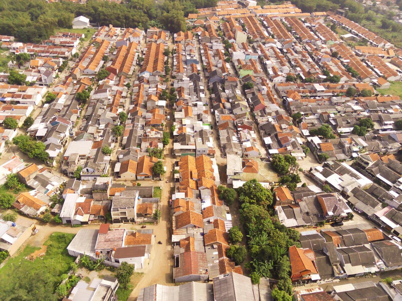 Overhead view of dense housing in Cikancung, West Java - Indonesia. Housing Industry. Panoramic Landscape. Graphic Resources. Social issues. Wallpapers Backgrounds. Aerial Landscape Photography photo