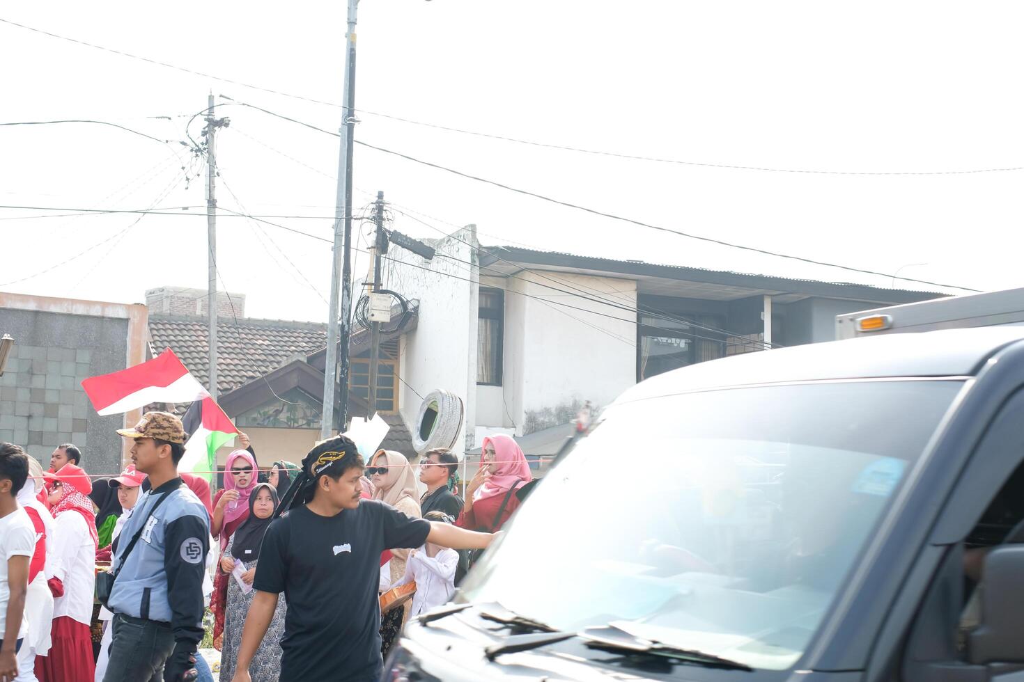 Cileunyi, West Java, Indonesia - August 17, 2024. Carnival celebrating Indonesia's 79th Independence Day. The parade was held on the side of the road which caused traffic jams. photo