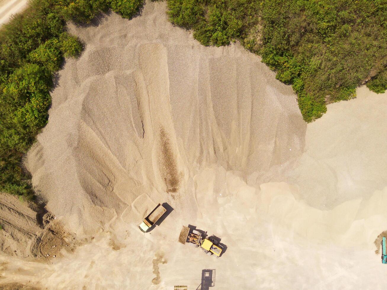 Landscape of truck and conveyor belt in the middle of sand pit. Mining Industry. Panoramic Landscape. Mining material transportation. Sand and stone mining. Drone Photography. Aerial Photography photo