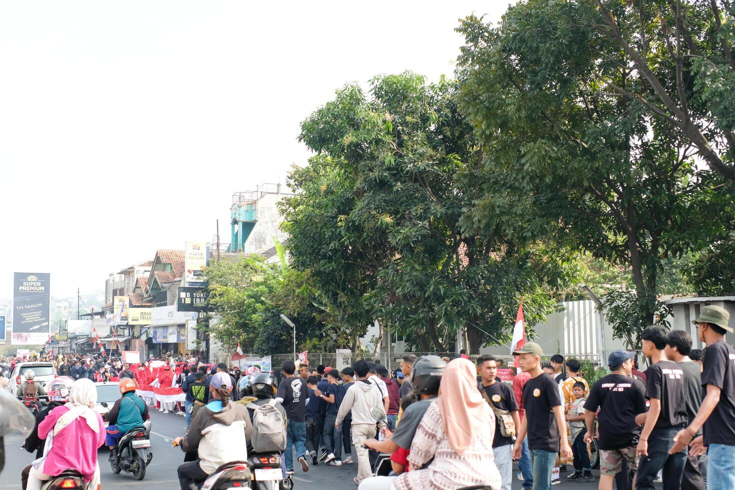 Cileunyi, West Java, Indonesia - August 17, 2024. Carnival celebrating Indonesia's 79th Independence Day. The parade was held on the side of the road which caused traffic jams. photo