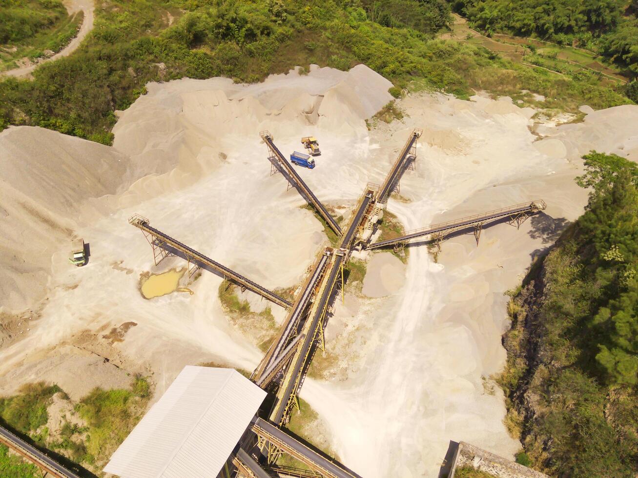Bird eye view of sand mining conveyor from a height of 200 meters. Mining Industry. Panoramic Landscape. Graphic Resources. Above. Drone Photography. Aerial Landscape Photography Concept photo