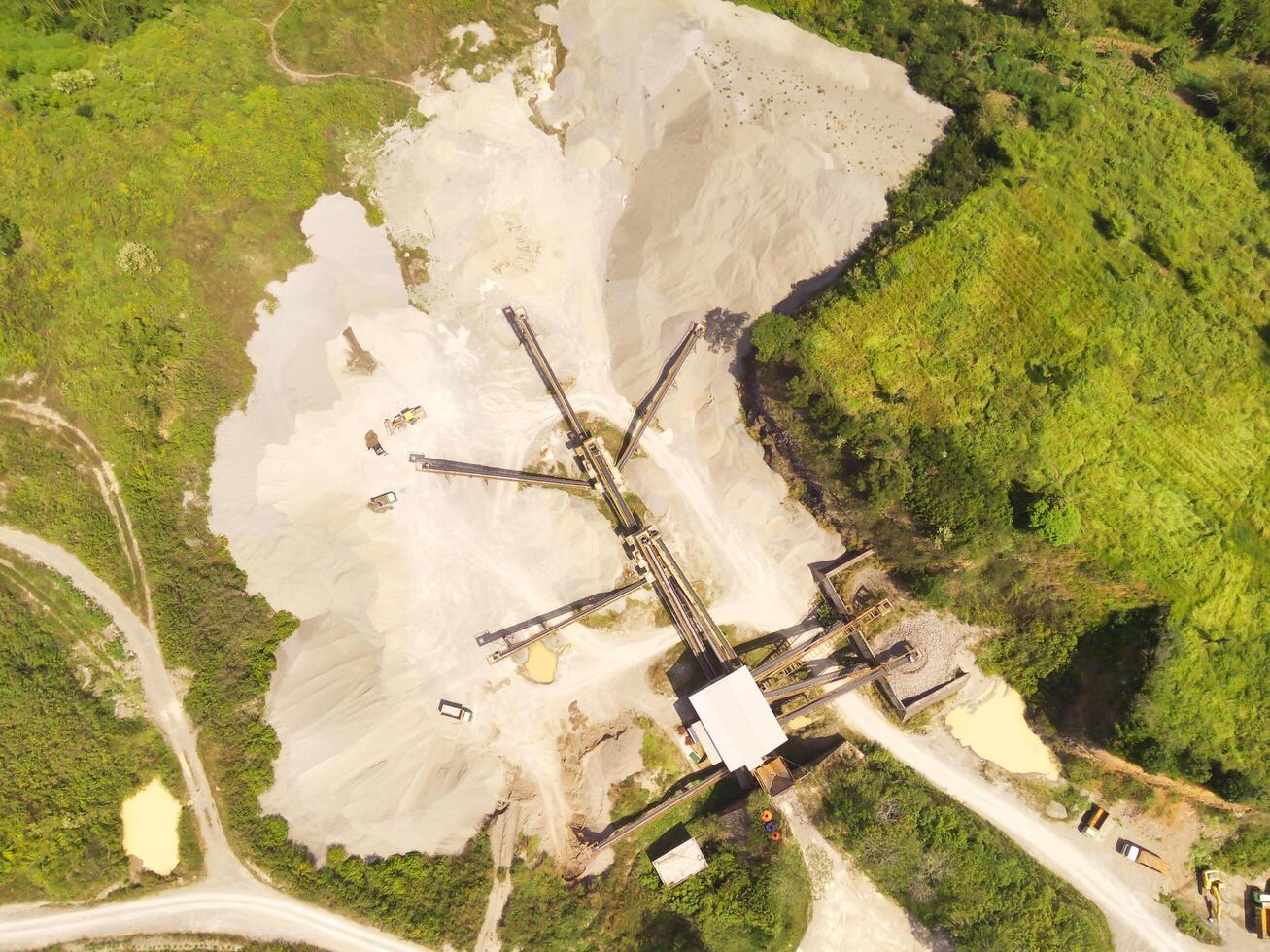 Bird eye view of sand mining conveyor from a height of 200 meters. Mining Industry. Panoramic Landscape. Graphic Resources. Above. Drone Photography. Aerial Landscape Photography Concept photo