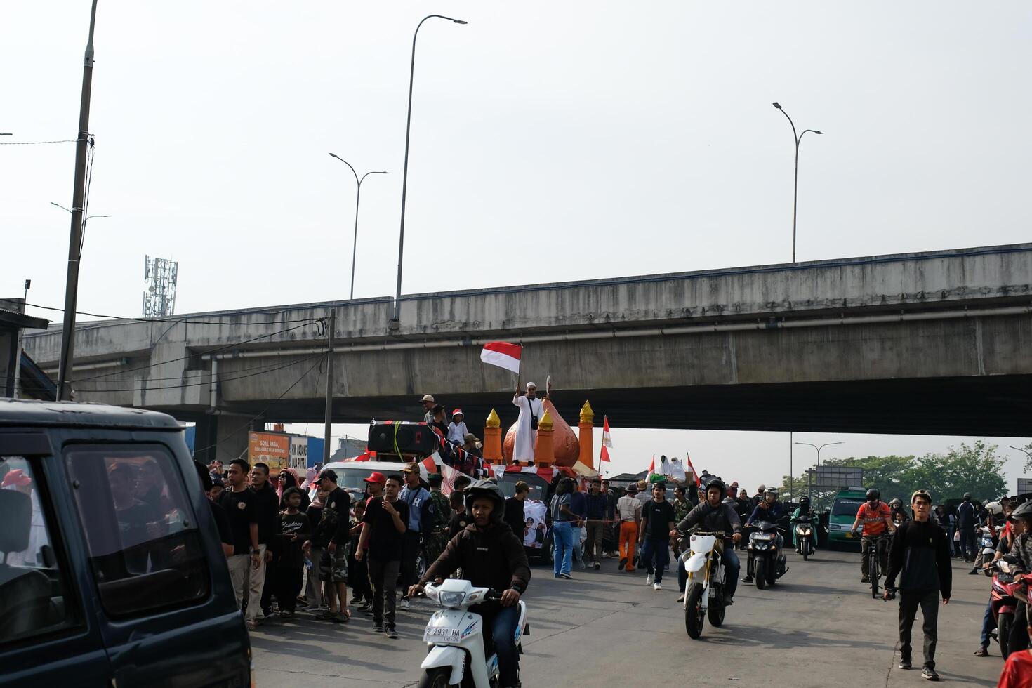 Cileunyi, West Java, Indonesia - August 17, 2024. Carnival celebrating Indonesia's 79th Independence Day. The parade was held on the side of the road which caused traffic jams. photo