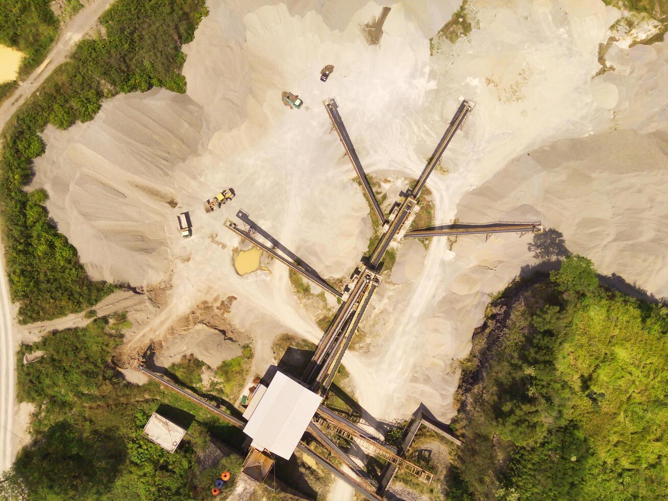 Bird eye view of sand mining conveyor from a height of 200 meters. Mining Industry. Panoramic Landscape. Graphic Resources. Above. Drone Photography. Aerial Landscape Photography Concept photo