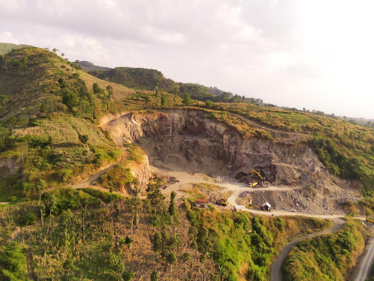 Aerial View of an industrial site on a mountain slope. Mining Industry. Panoramic Landscape. Graphic Resources. Mines and sand pits. Aerial Landscape Photography Concept photo