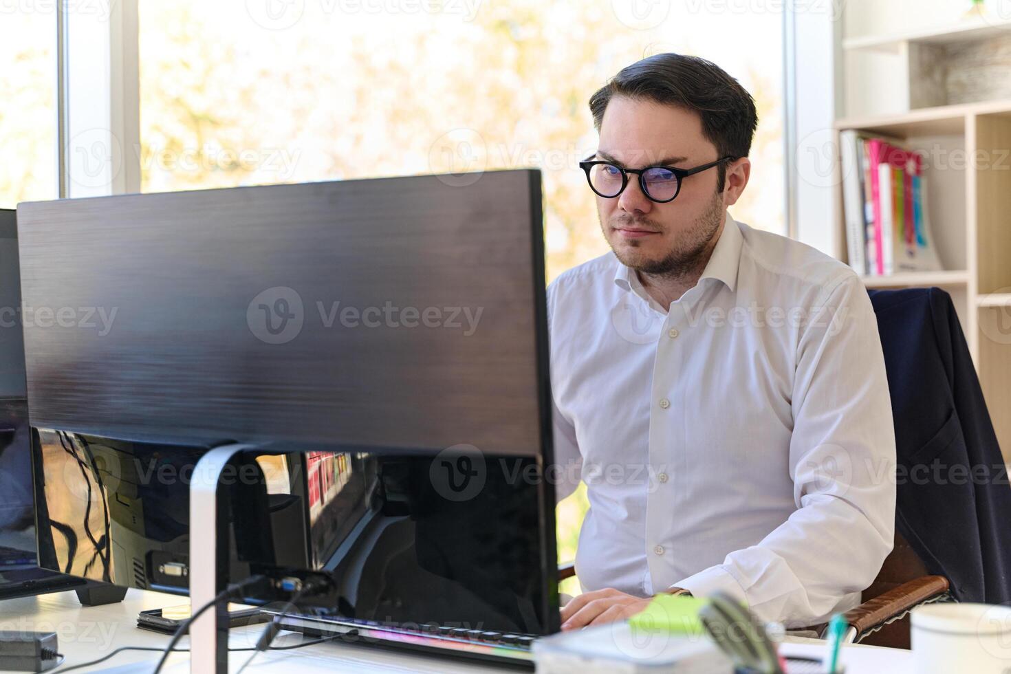 Company Director in a Modern Office, Focused on Work at Computer photo