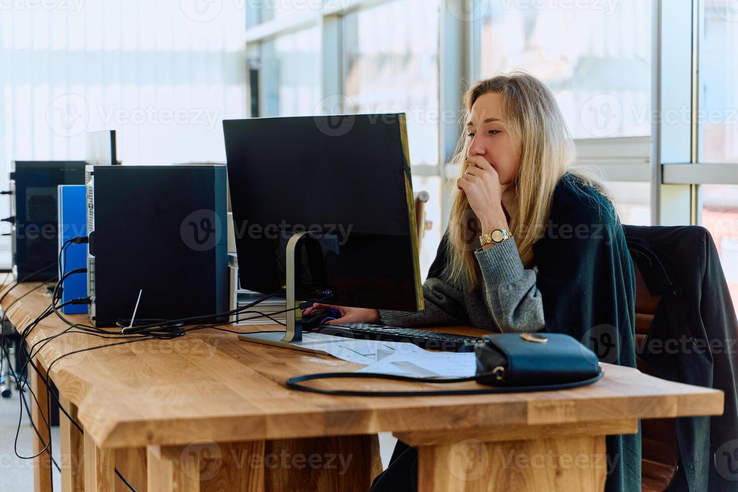 Businesswoman Programming a Product Design for Wood Processing Machine in Modern Office photo