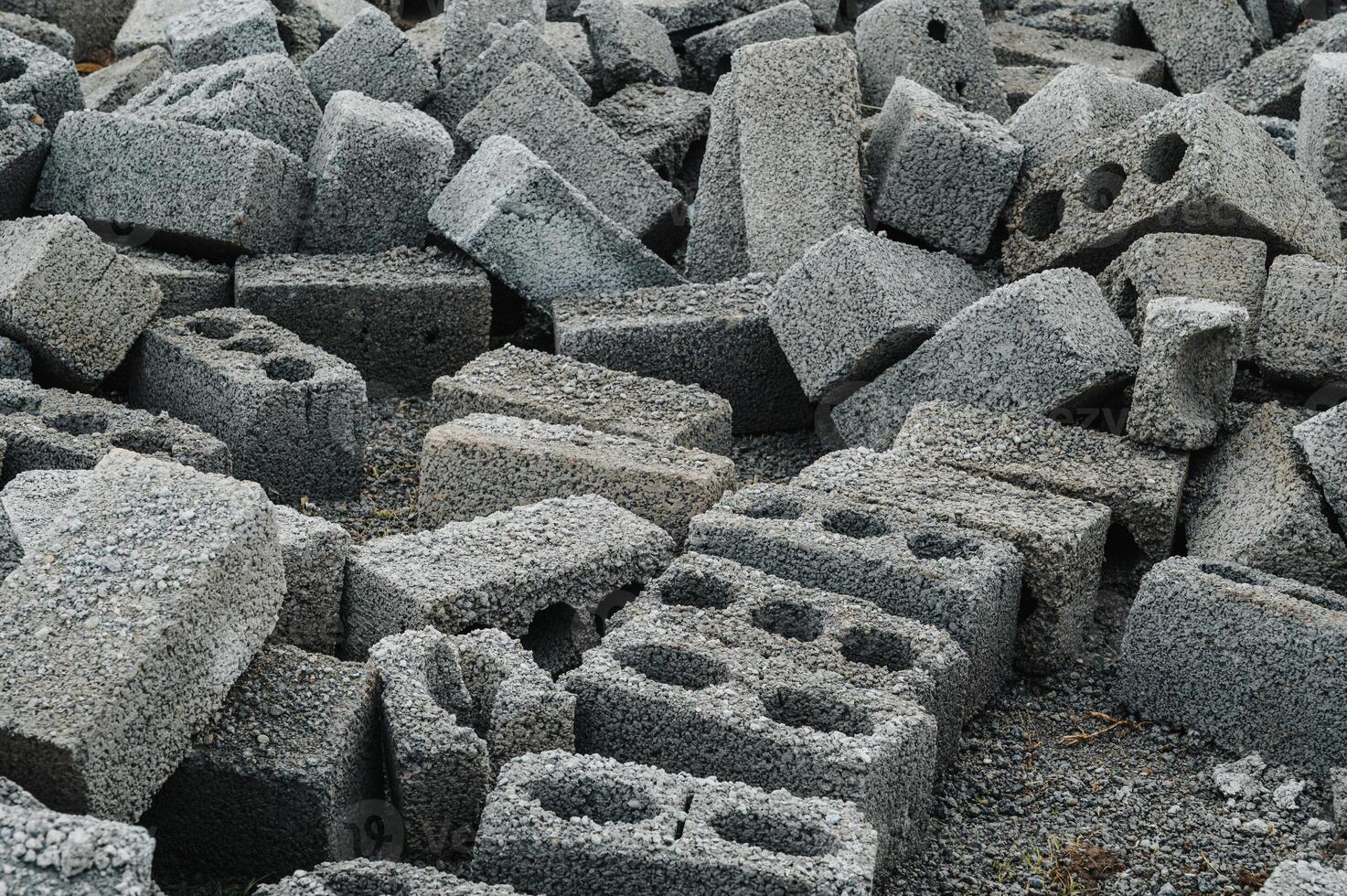 a pile of cinder blocks made of gray concrete, a material for building a house photo