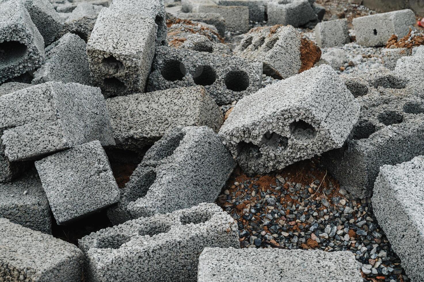 a pile of cinder blocks on a construction site. photo