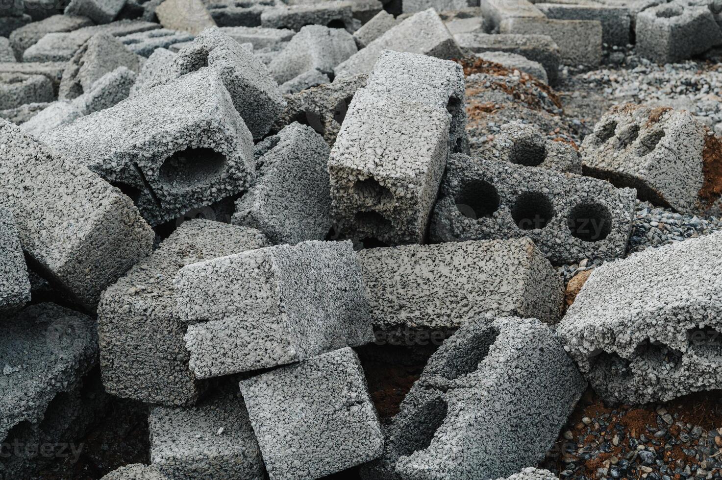 a pile of cinder blocks made of gray concrete, a material for building a house photo