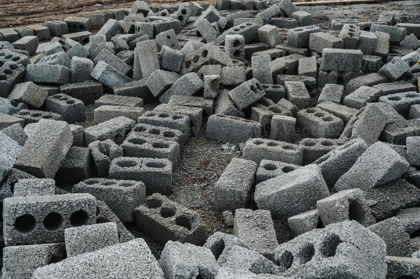 a pile of cinder blocks on a construction site. photo