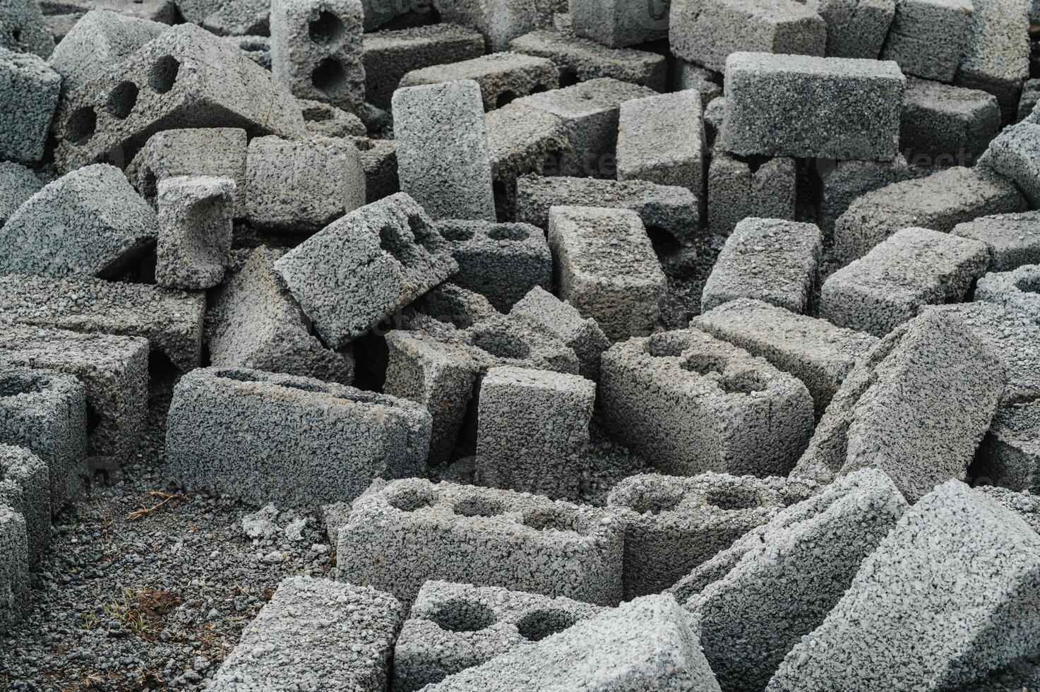 a pile of cinder blocks on a construction site. photo