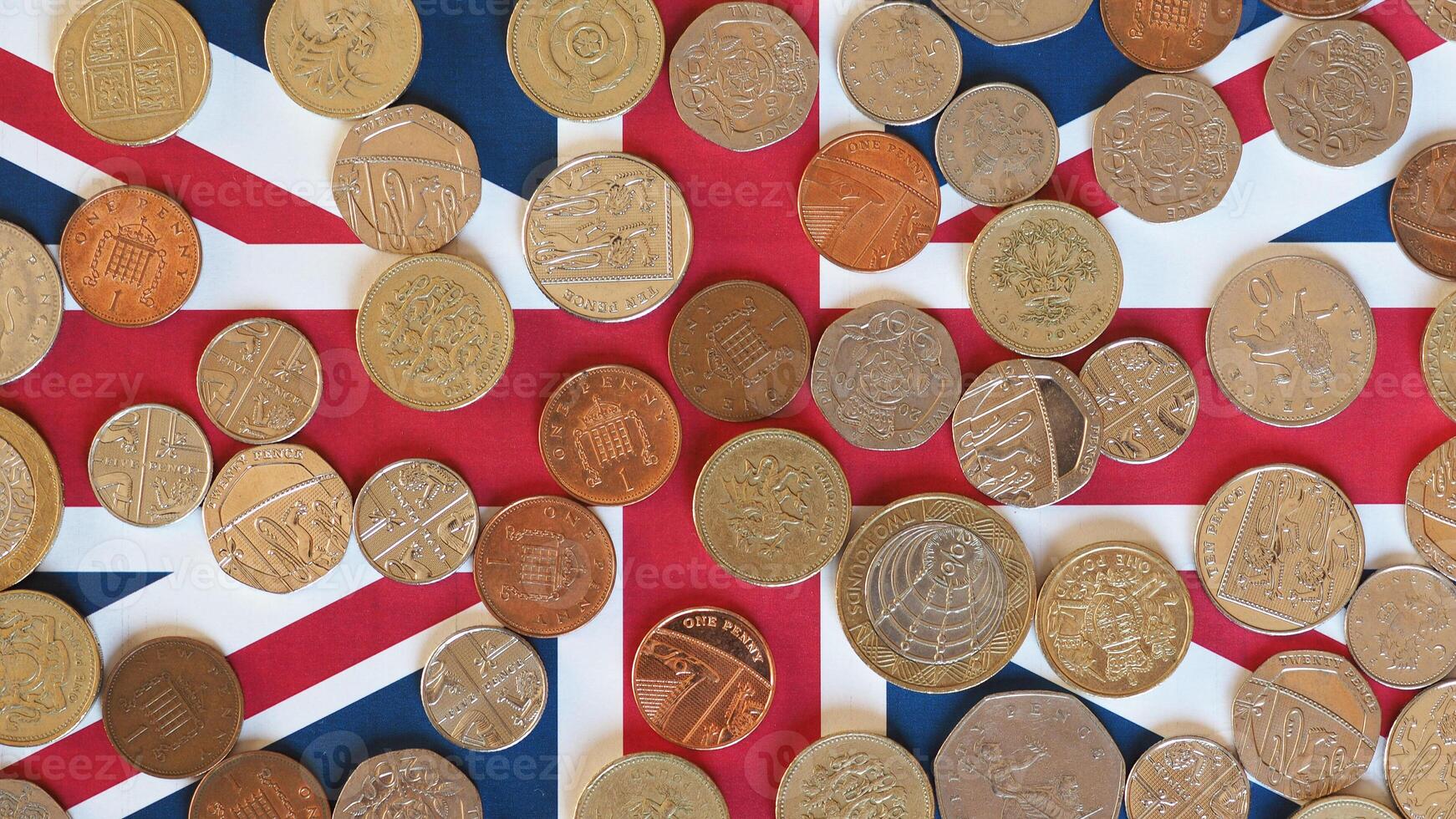 Pound coins over UK flag photo
