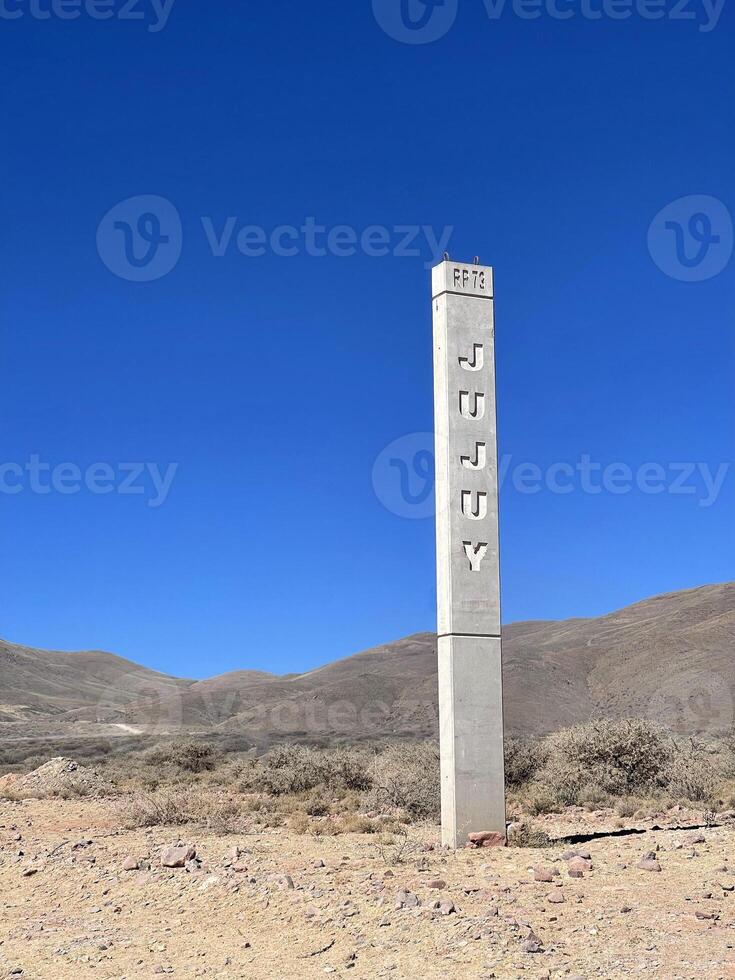 Obelisk with the Jujuy inscription in the Andes, Jujuy region, Argentina photo