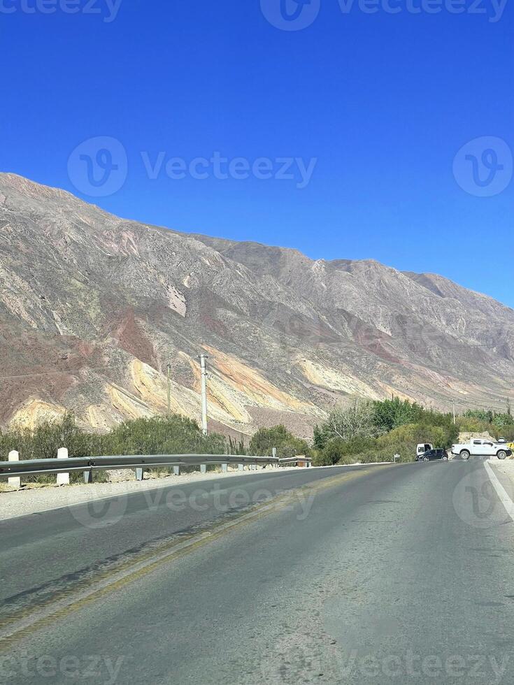 Empty road on the way to the Andes from Salta, Argentina photo