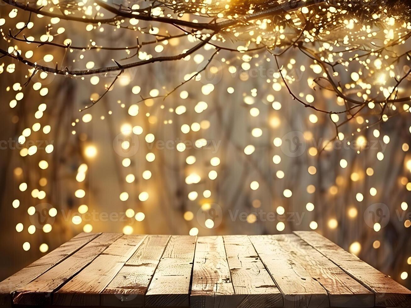 Christmas and New year background with empty wooden table, garland, tree branch. Festive decor with bokeh lights and free space for product montage photo