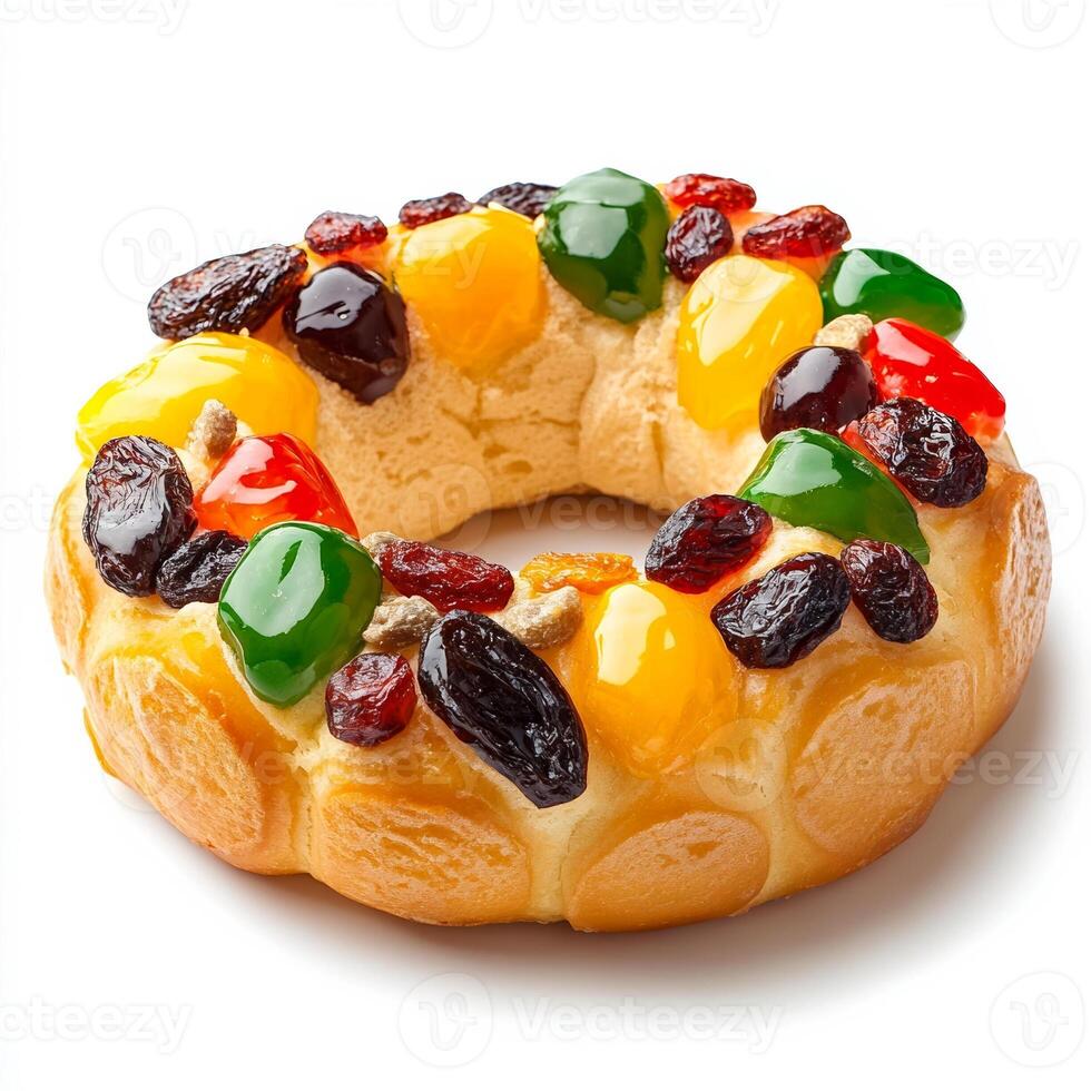 Mexican rosca de reyes, a ring shaped sweet bread decorated with dried fruits, for Epiphany, isolated on white background, side view photo