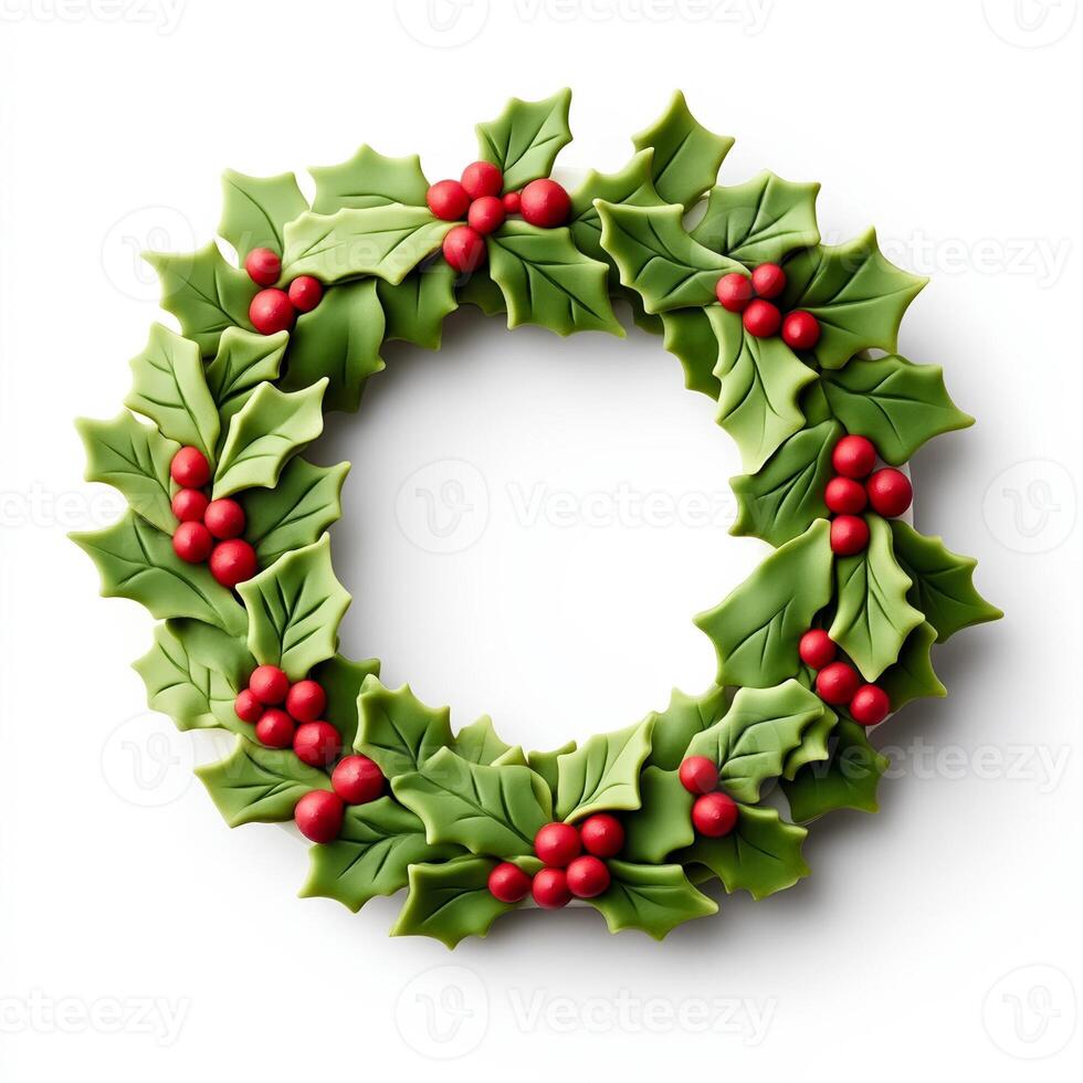 Top view of a Christmas wreath cake decorated with fondant holly and ribbons isolated on white background photo
