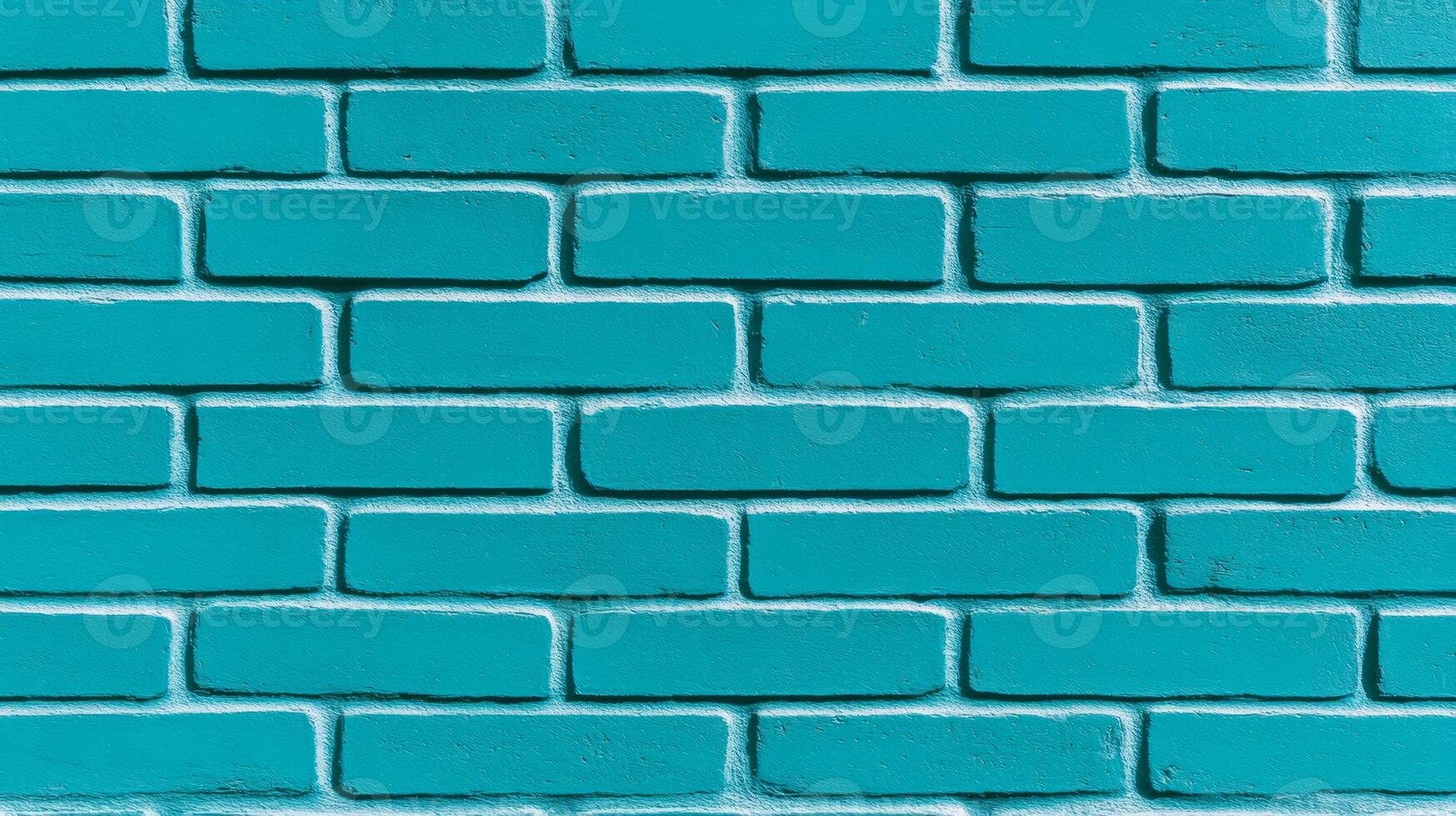 Closeup of a textured painted brick wall in vibrant turquoise showing rough brush strokes and slightly uneven coverage perfect for a bold and modern design aesthetic photo
