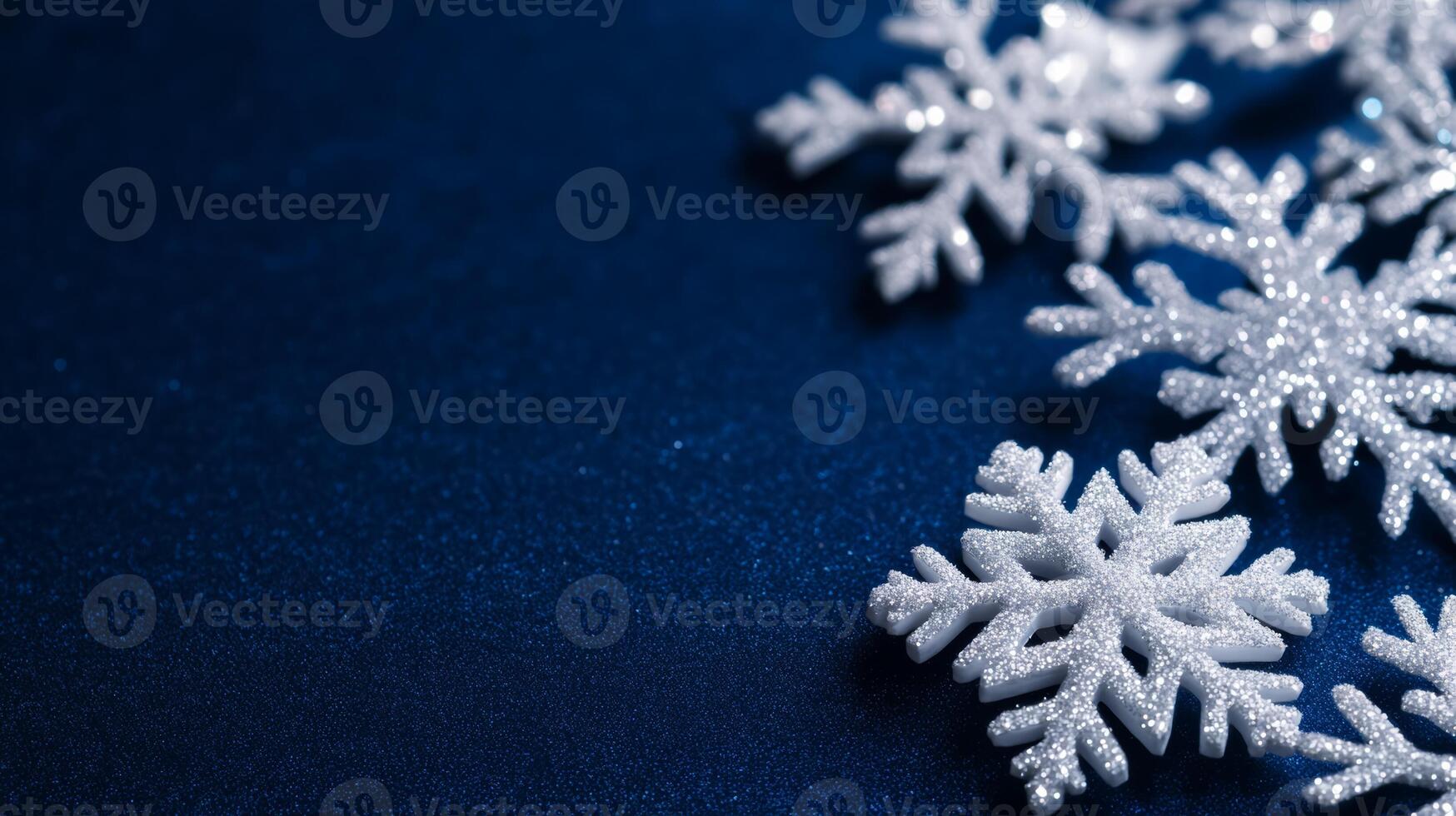 Midnight blue background snowflakes gently falling frosty Christmas night glowing stars festive winter atmosphere perfect for holiday wishes blank space on the right photo