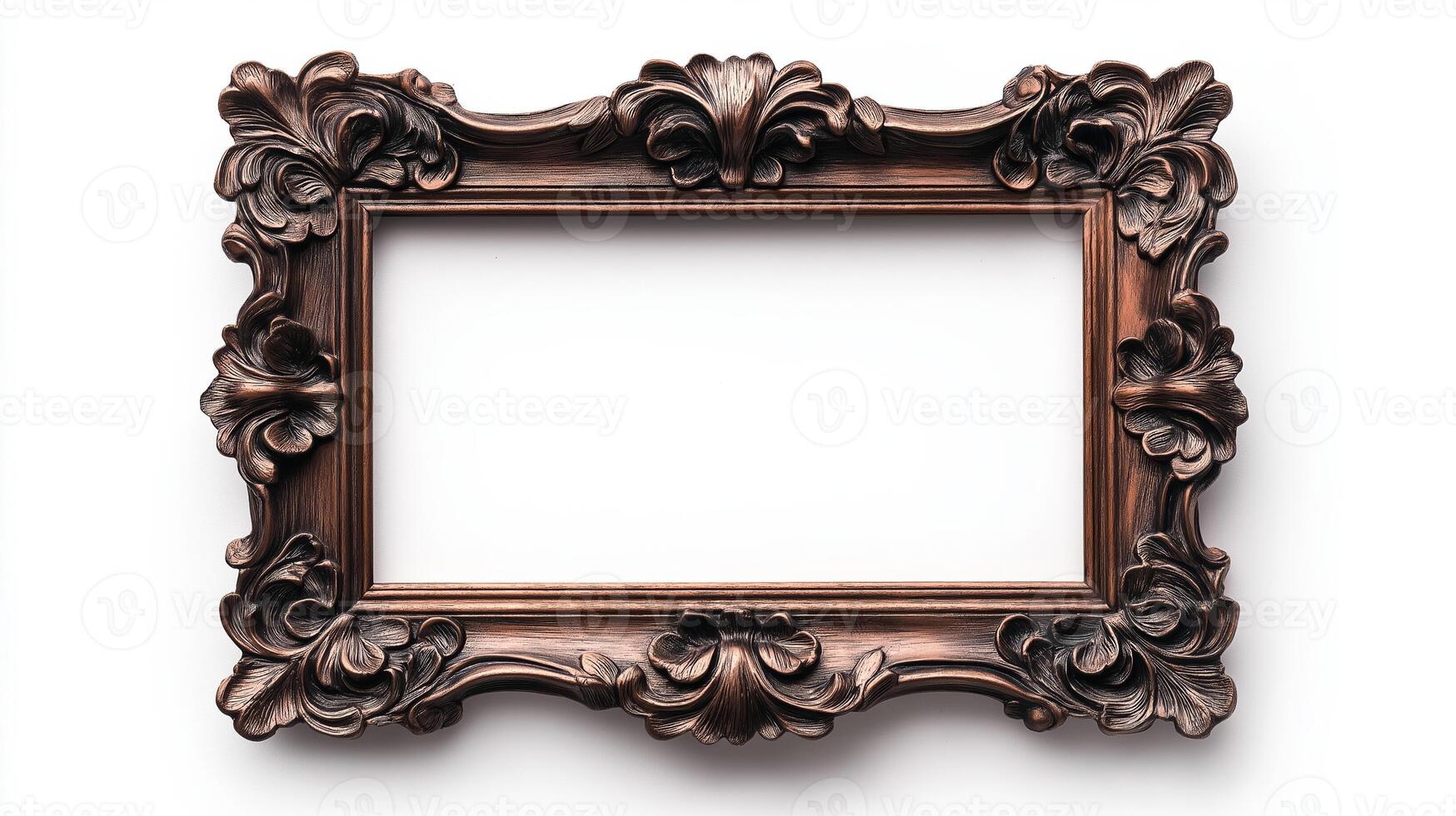 Close up of a small intricately detailed vintage picture frame with floral motifs and an aged bronze finish isolated on a white background casting a soft shadow photo