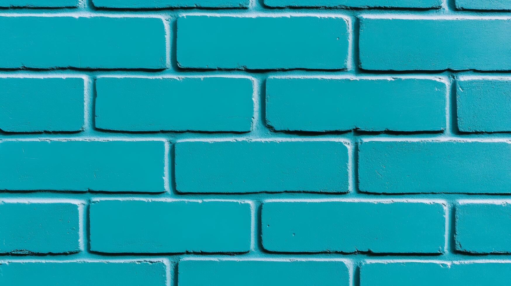 Closeup of a textured painted brick wall in vibrant turquoise showing rough brush strokes and slightly uneven coverage perfect for a bold and modern design aesthetic photo