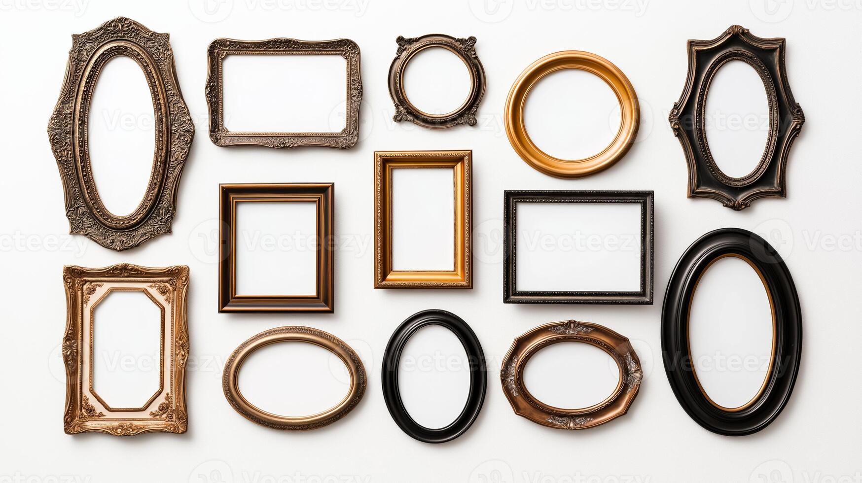 Overhead view of a collection of vintage ornate picture frames in various shapes including oval round and rectangular arranged on a white background empty and ready for use photo