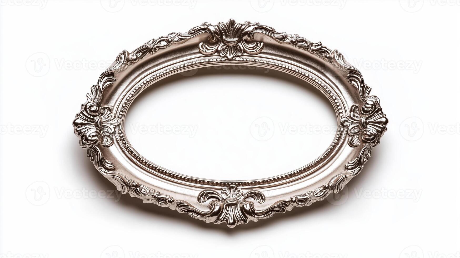 Side view of a vintage oval picture frame with a delicate lace like pattern and a slightly tarnished silver finish isolated on a white background with soft diffused shadows photo