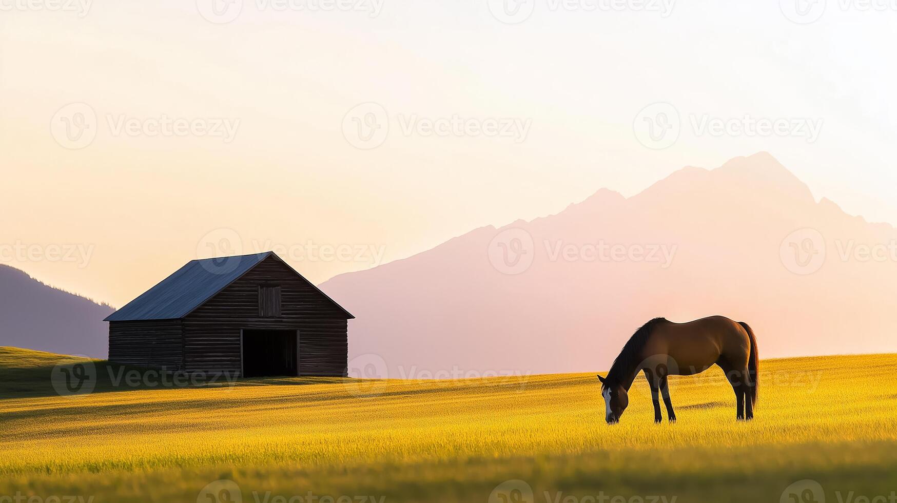 A horse grazing peacefully in a ranch field with a wooden barn and mountains in the distance warm morning light photo