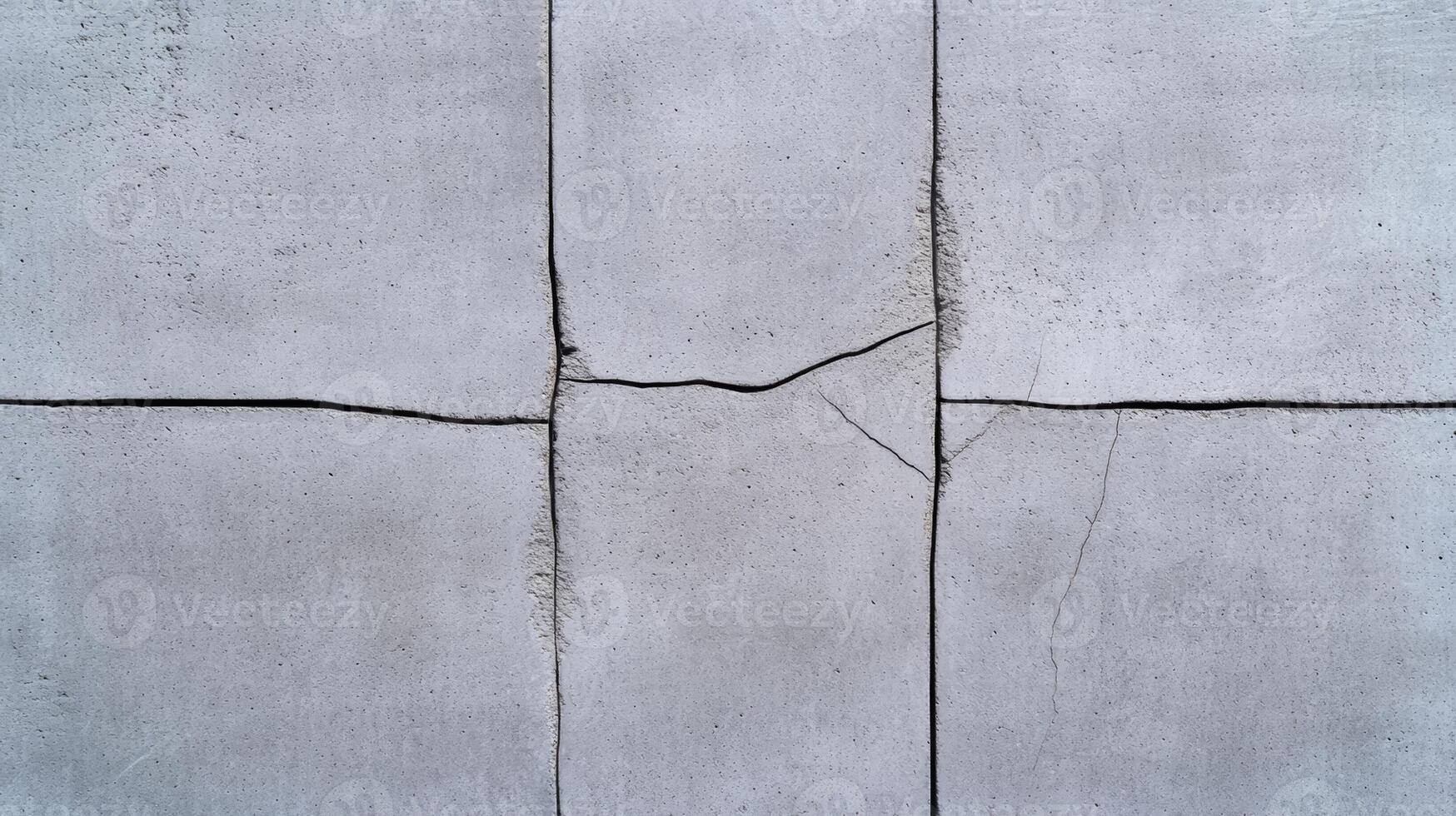 Closeup of a textured concrete wall background with rough uneven surfaces and small cracks subtle gray tones with a slightly gritty texture ideal for minimalist designs photo