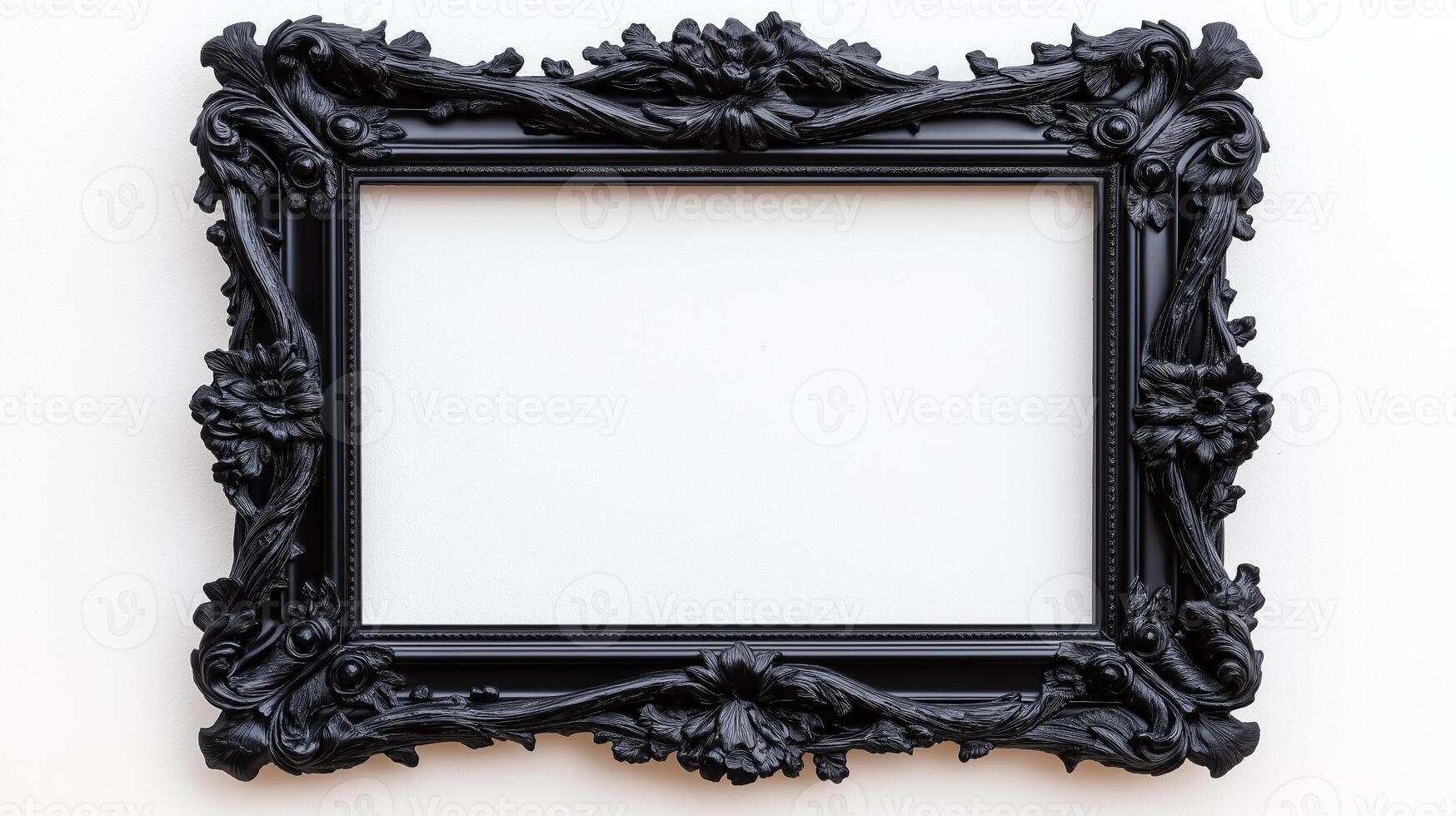 Overhead shot of a gothic picture frame with creepy designs like gargoyles and twisted branches finished in a matte black isolated on a white background photo