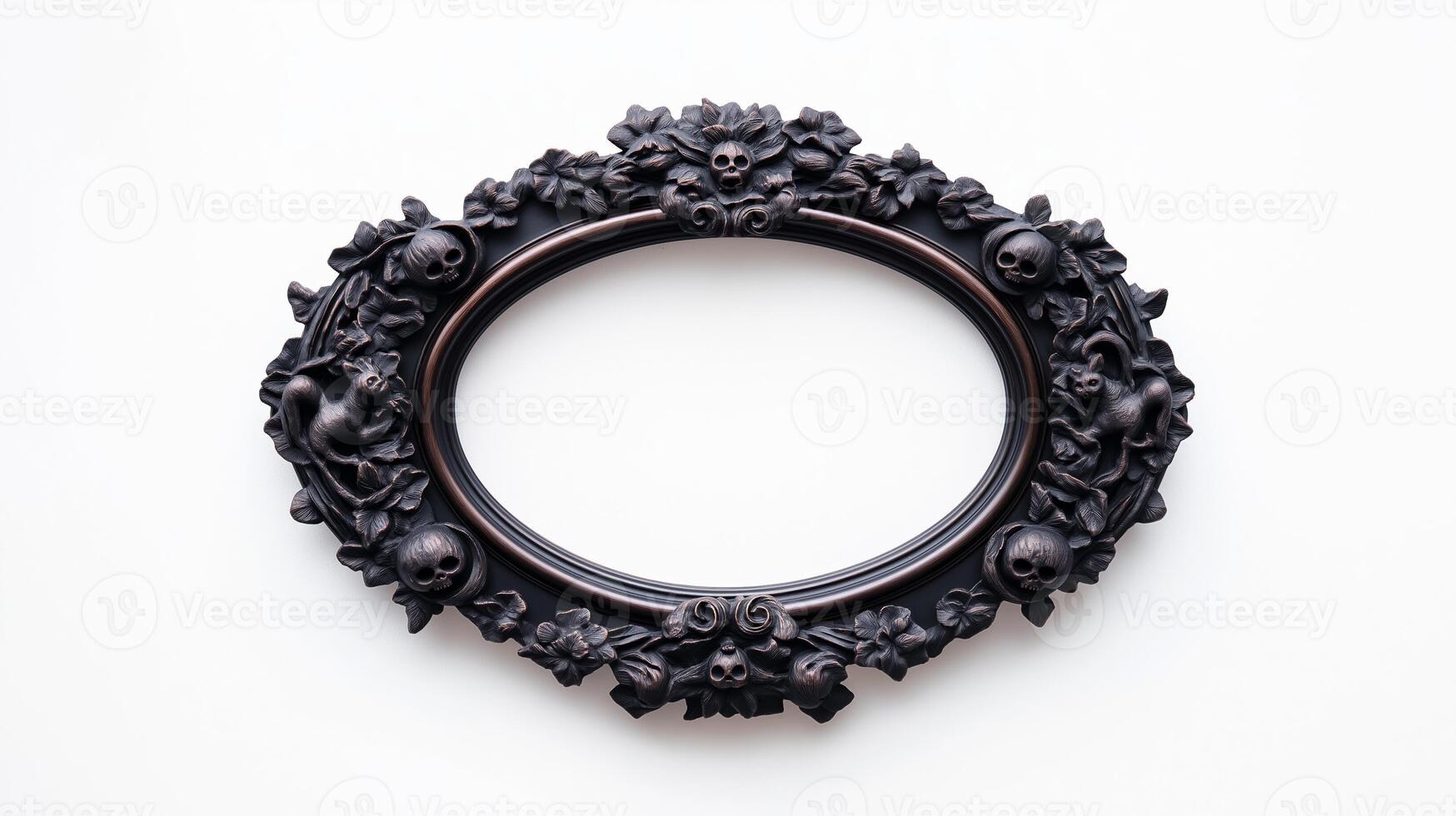 Overhead view of an oval Halloween style picture frame with intricate carvings of witches black cats and moons finished in a dark eerie patina isolated on a white background photo