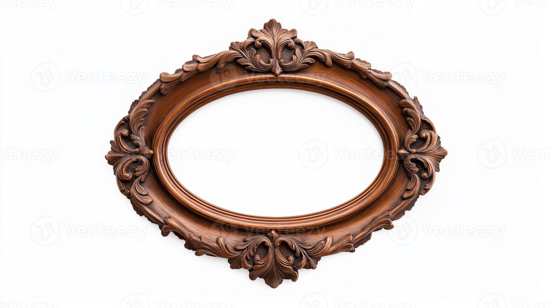 Wide angle shot of a vintage oval shaped picture frame with elaborate carvings and patina featuring baroque style scrolls and leaves isolated on a pure white background photo