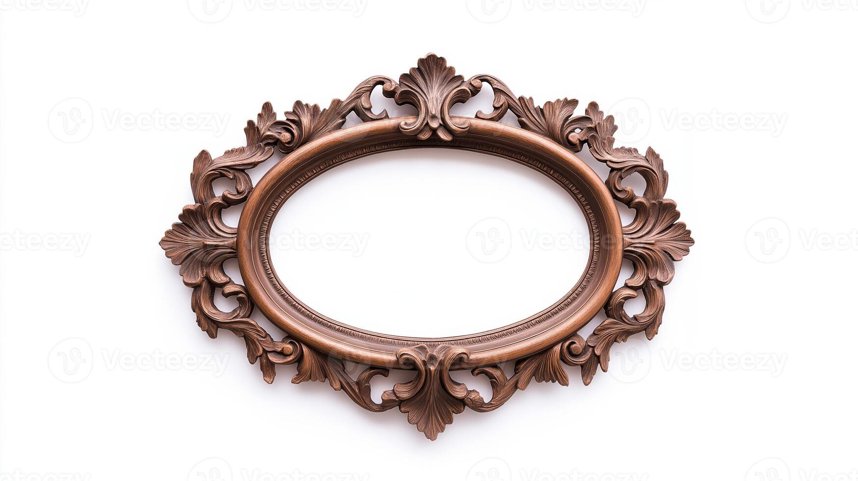 Wide angle shot of a vintage oval shaped picture frame with elaborate carvings and patina featuring baroque style scrolls and leaves isolated on a pure white background photo