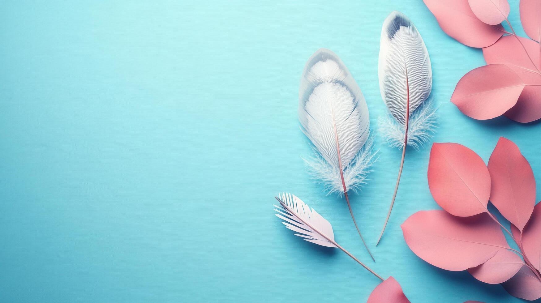 Elegant Composition of White Feathers and Pink Paper Leaves on a Light Blue Background photo