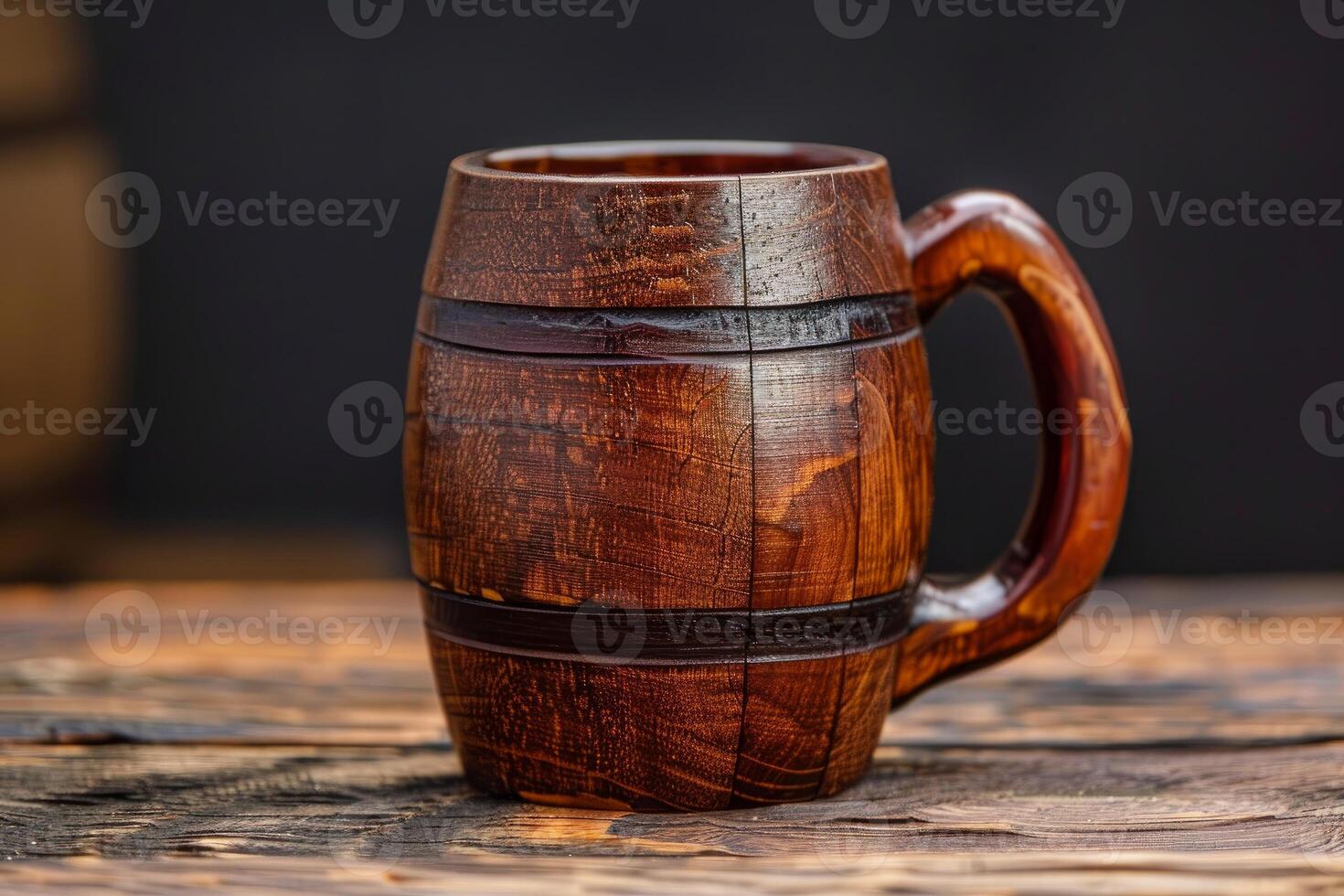 Wooden beer mug standing on a rustic table in a pub concept photo