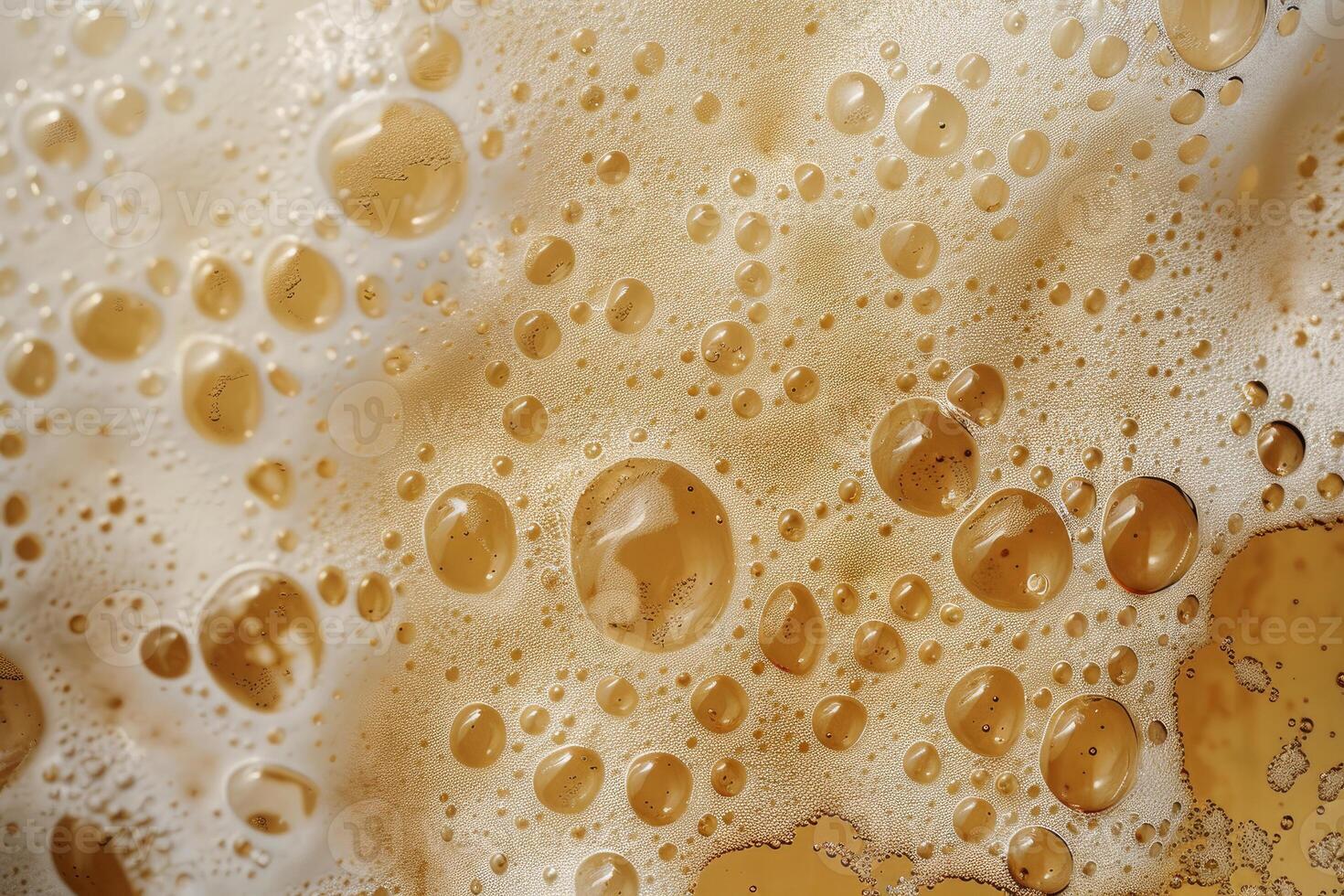 Closeup of beer bubbles creating an abstract pattern with a golden color palette photo