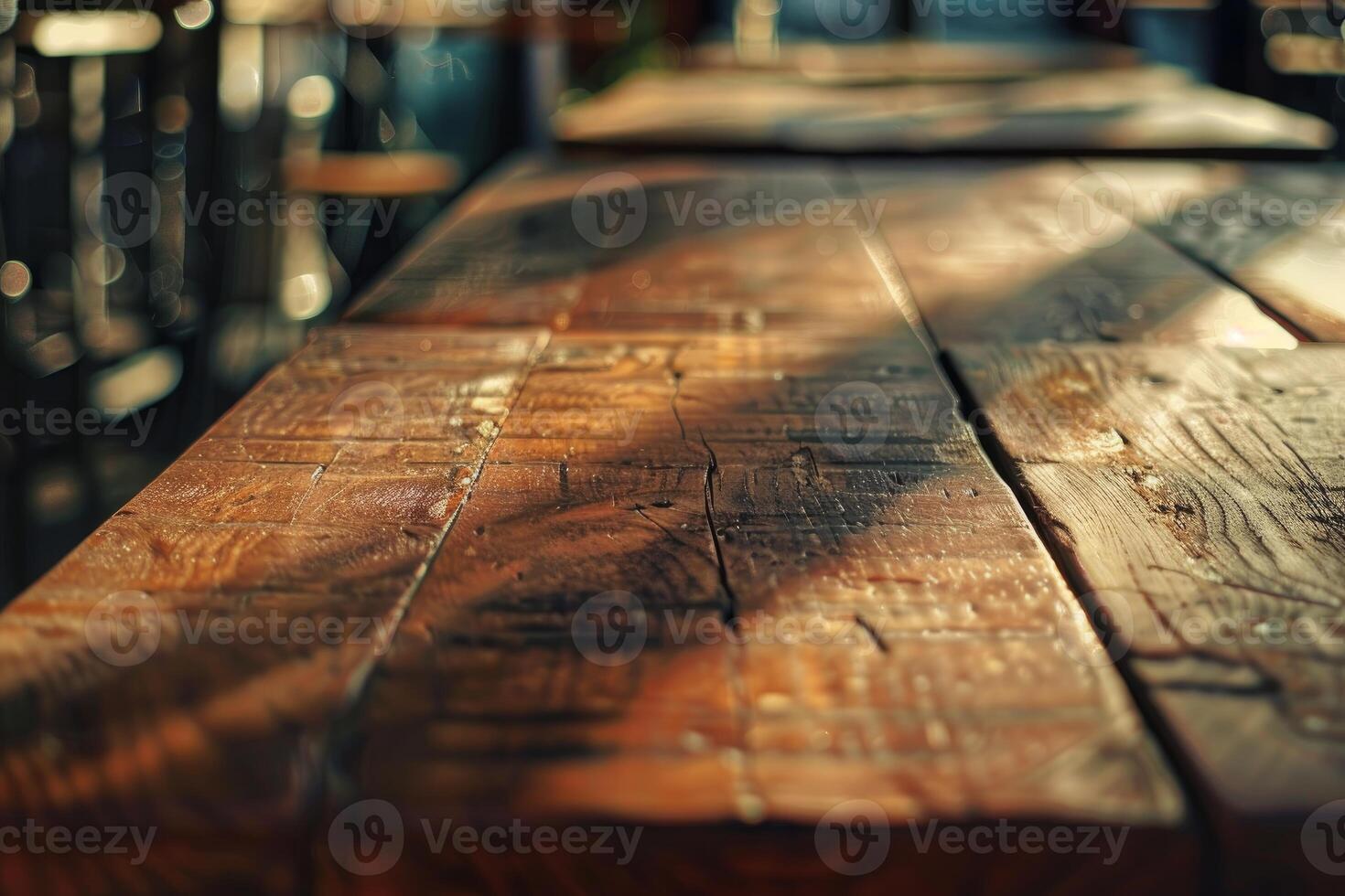 Sunlight illuminating surface of empty rustic wooden table photo