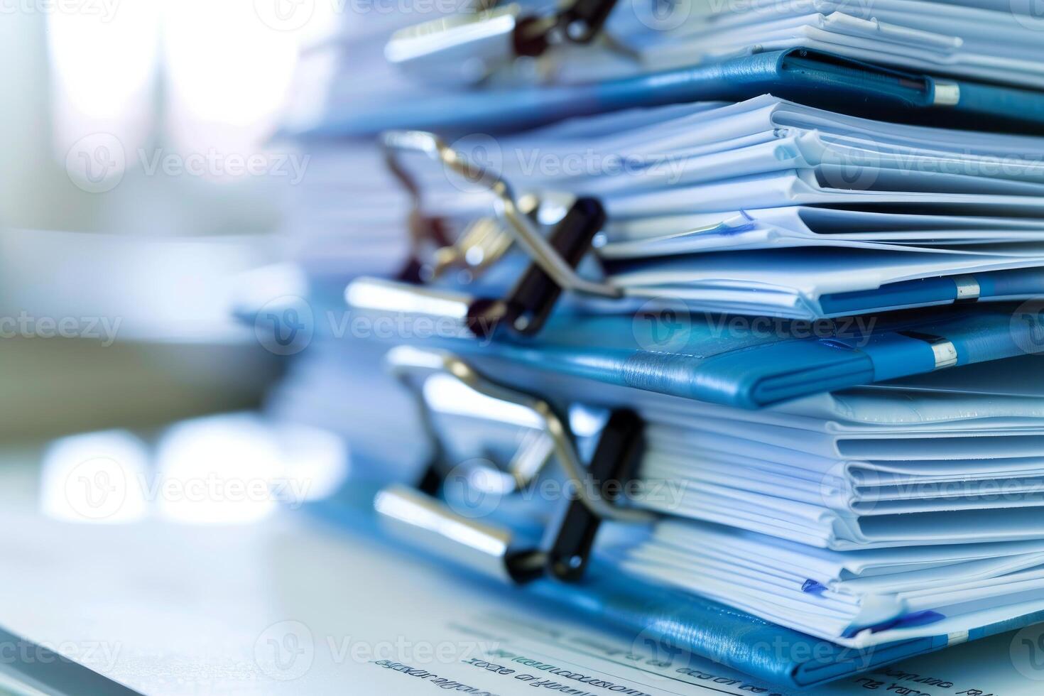 Stack of folders overflowing with paperwork representing bureaucracy photo