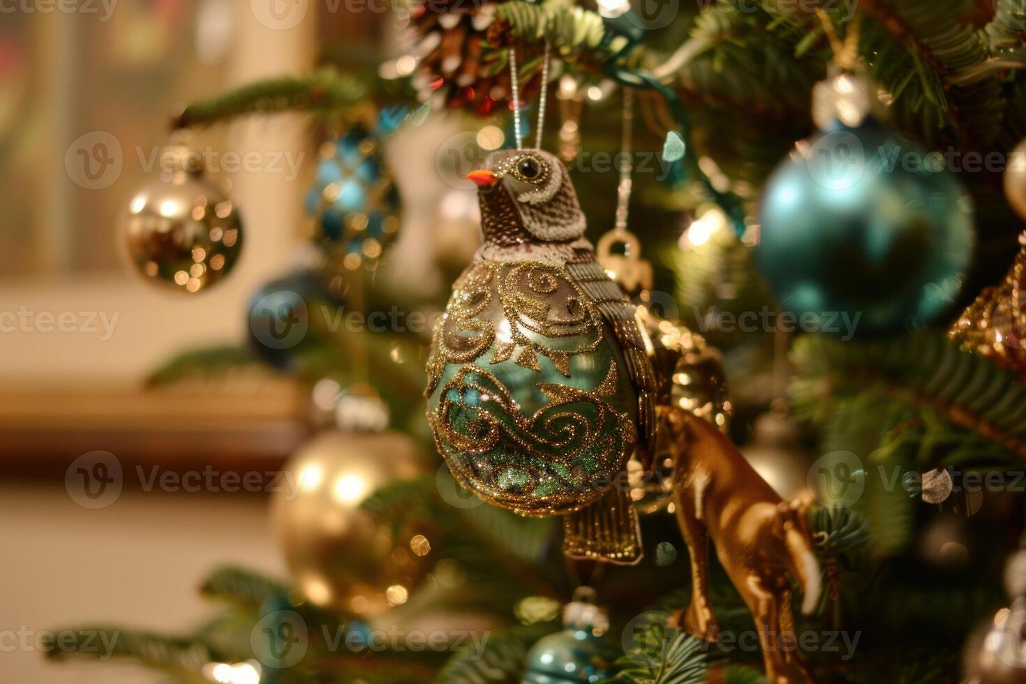 Elegant glass bird ornament hanging on a christmas tree photo