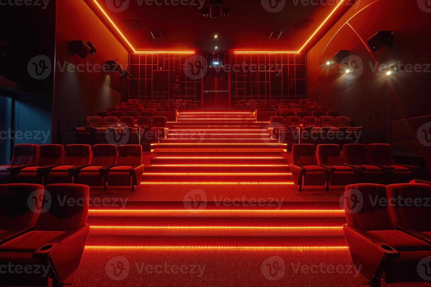 Red illumination is highlighting empty comfortable seats in modern cinema hall photo