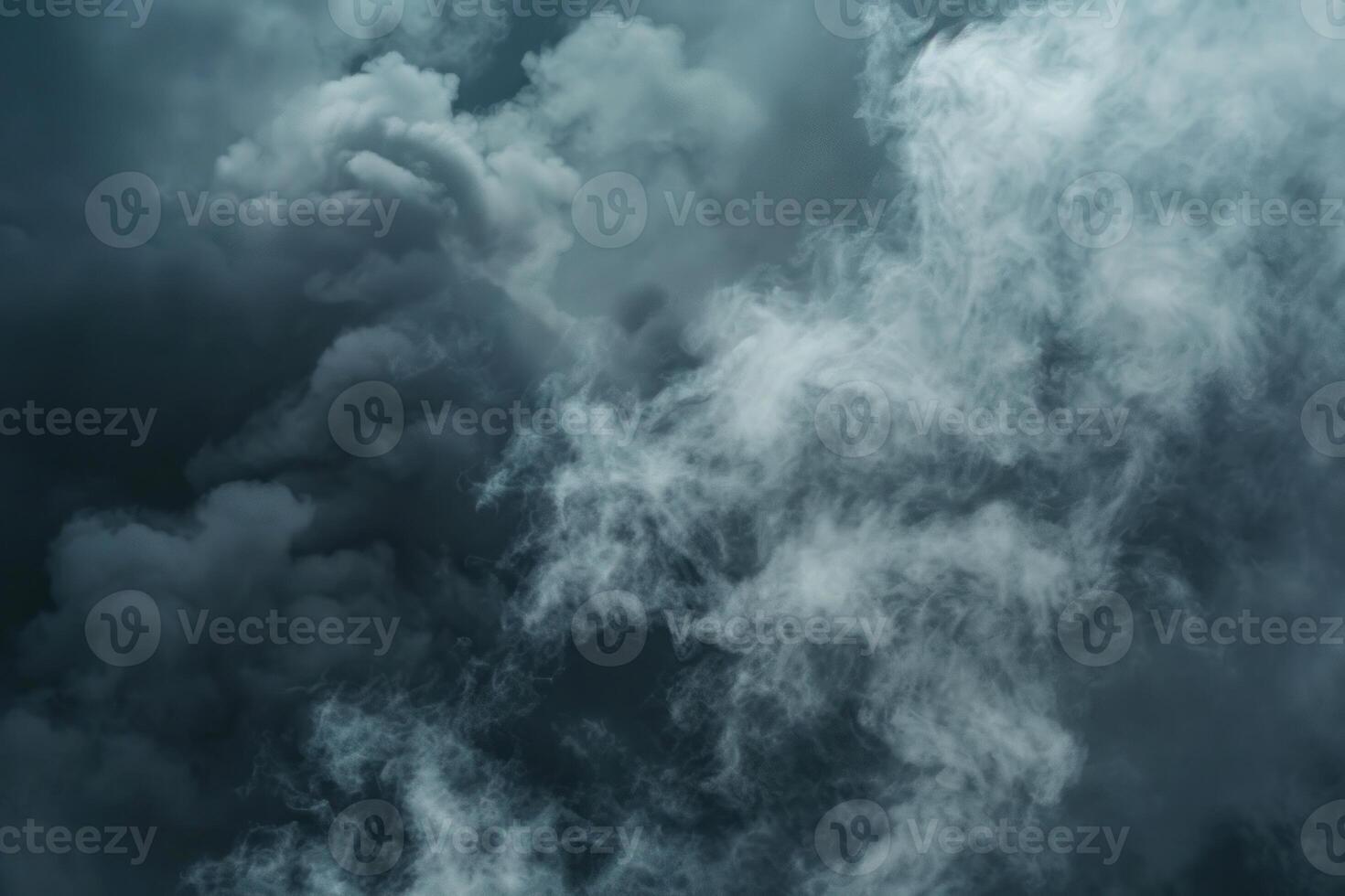 Dark storm clouds gathering in the sky forming a dramatic background photo