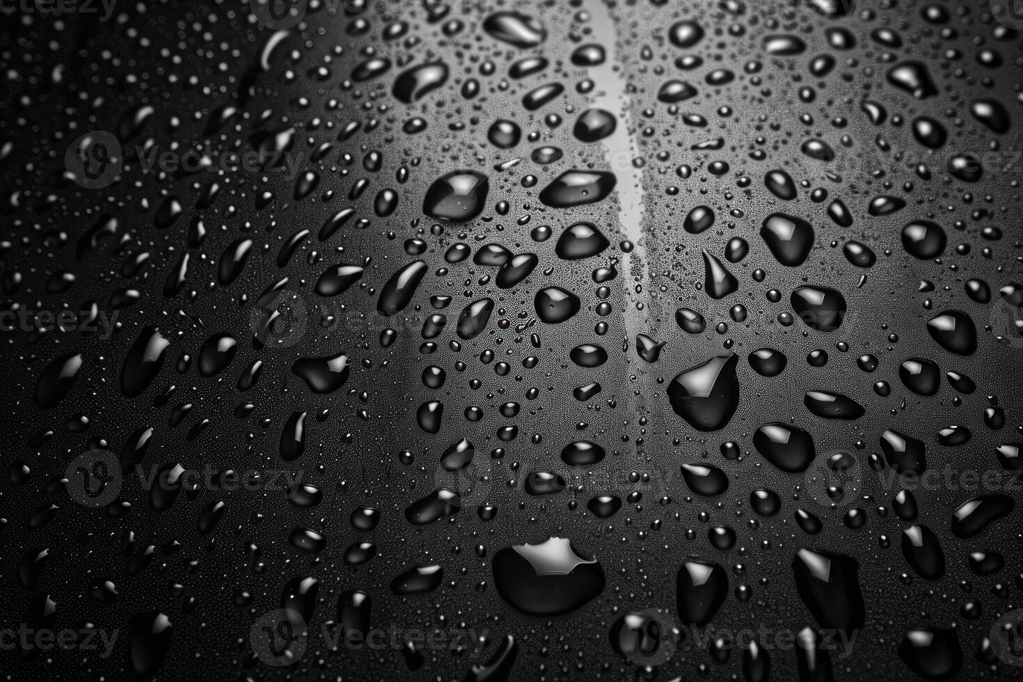 Water droplets forming on a smooth surface creating an abstract pattern photo