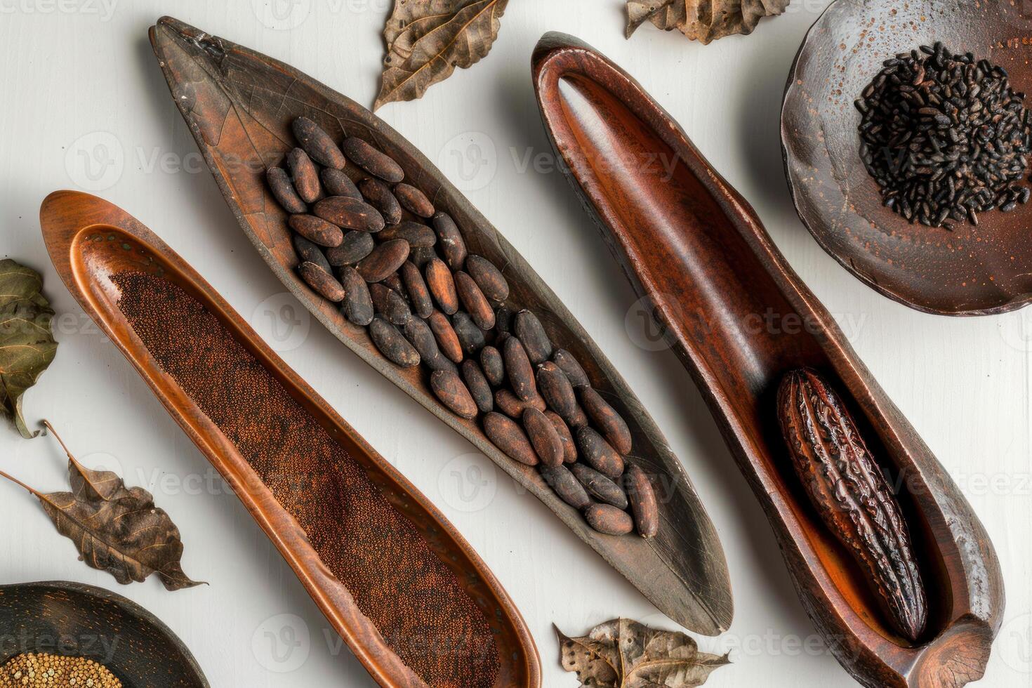 Cocoa beans and cocoa powder in wooden bowls displayed on white tabletop photo