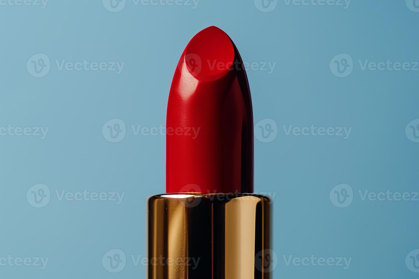 Luxurious red lipstick against blue background photo